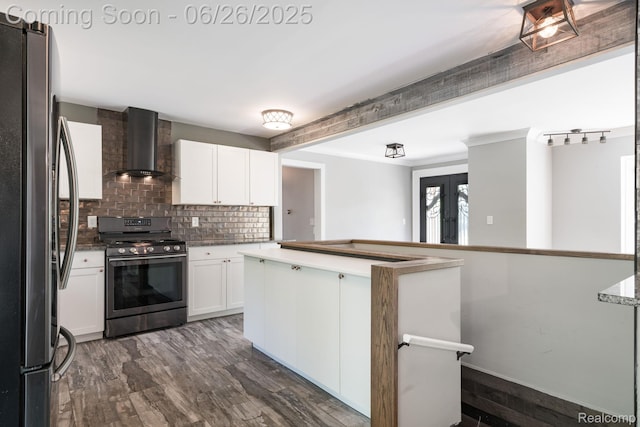 2905 Lahser Rd, Bloomfield Hills, MI 48304 - kitchen with appliances with stainless steel finishes, wall chimney range hood, decorative backsplash, white cabinetry, and french doors