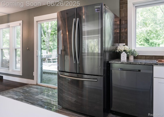 2905 Lahser Rd, Bloomfield Hills, MI 48304 - kitchen featuring freestanding refrigerator, dishwashing machine, plenty of natural light, and white cabinets