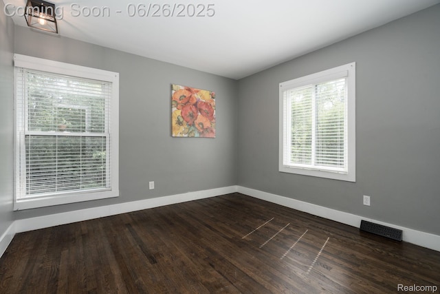 2905 Lahser Rd, Bloomfield Hills, MI 48304 - empty room featuring plenty of natural light and dark wood-style flooring