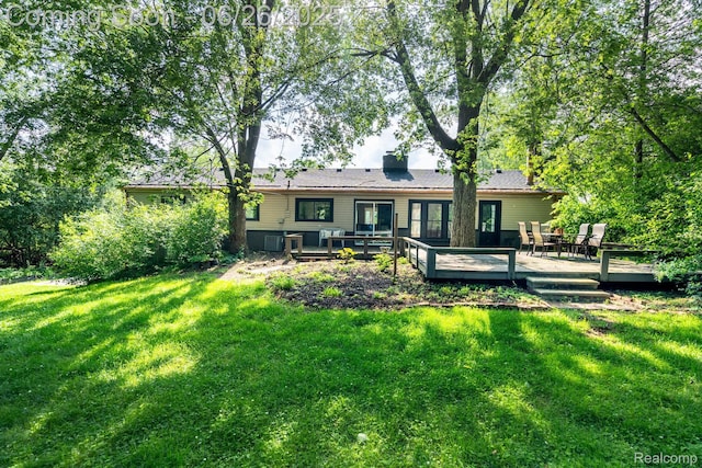 2905 Lahser Rd, Bloomfield Hills, MI 48304 - back of house featuring a deck and a lawn
