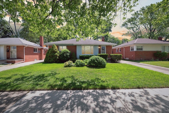 13210 Tecumseh Ave, Redford, MI 48239 - view of front of property with a chimney, brick siding, and a lawn