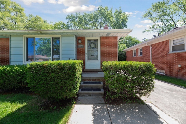 13210 Tecumseh Ave, Redford, MI 48239 - view of front facade with a chimney and brick siding