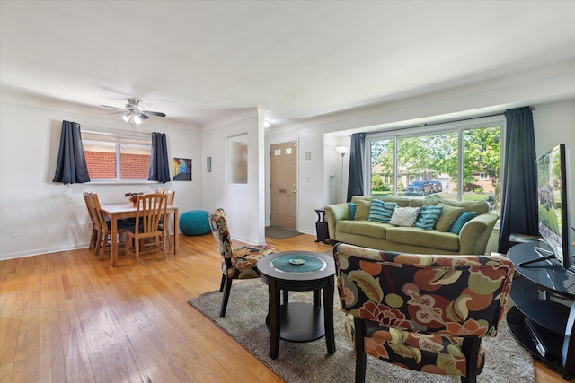 13210 Tecumseh Ave, Redford, MI 48239 - living area with light wood-style flooring, plenty of natural light, and a ceiling fan
