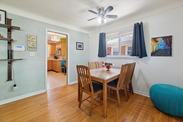 13210 Tecumseh Ave, Redford, MI 48239 - dining area with light wood-style floors and a ceiling fan