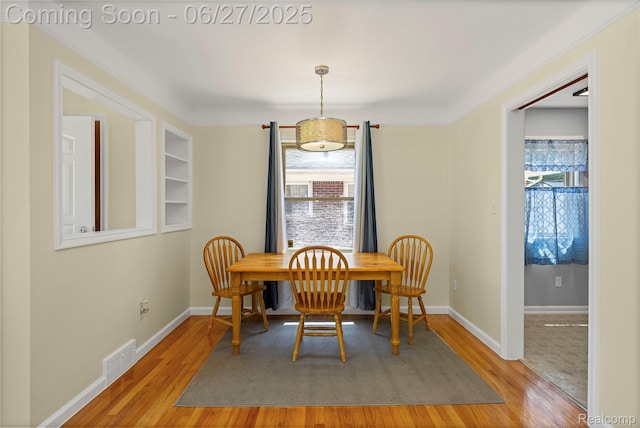 17381 Lennane, Redford, MI 48240 - dining room with light wood-style flooring and crown molding