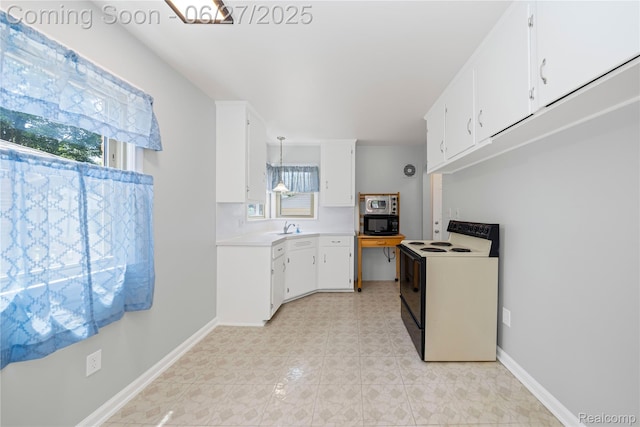 17381 Lennane, Redford, MI 48240 - kitchen featuring range with electric stovetop, black microwave, plenty of natural light, and white cabinetry
