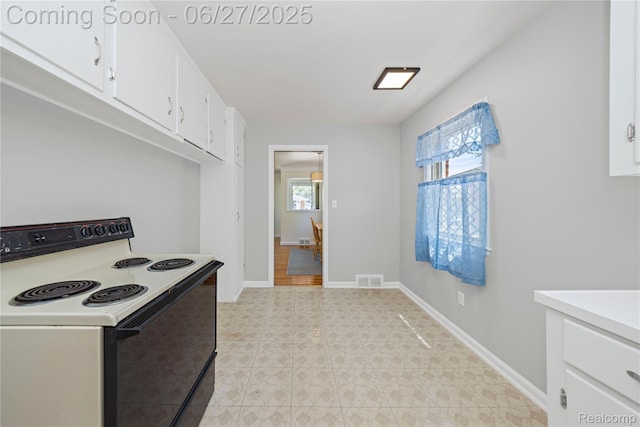 17381 Lennane, Redford, MI 48240 - kitchen featuring electric range, white cabinetry, and light countertops
