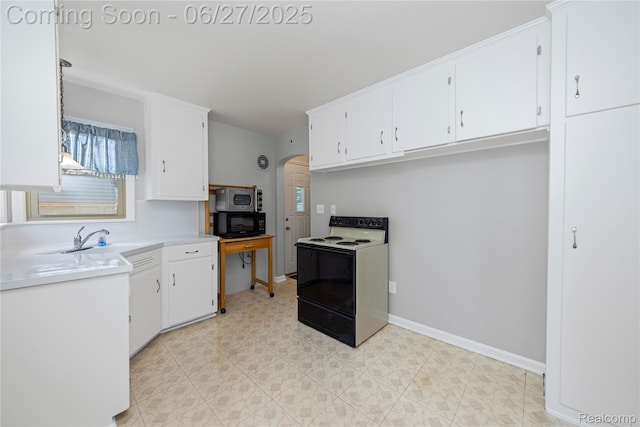17381 Lennane, Redford, MI 48240 - kitchen featuring electric stove, stainless steel microwave, black microwave, arched walkways, and white cabinetry