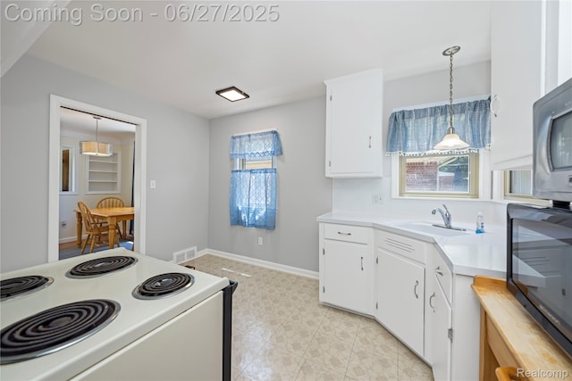 17381 Lennane, Redford, MI 48240 - kitchen featuring electric range, light countertops, pendant lighting, white cabinetry, and light flooring