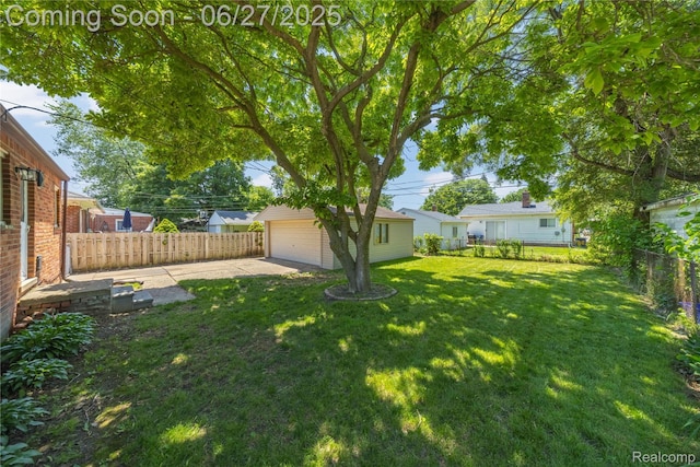 17381 Lennane, Redford, MI 48240 - fenced backyard featuring a detached garage and an outbuilding