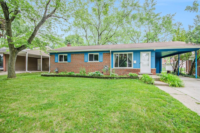 1621 Whittier Rd, Ypsilanti, MI 48197 - ranch-style home featuring brick siding, driveway, and a front lawn