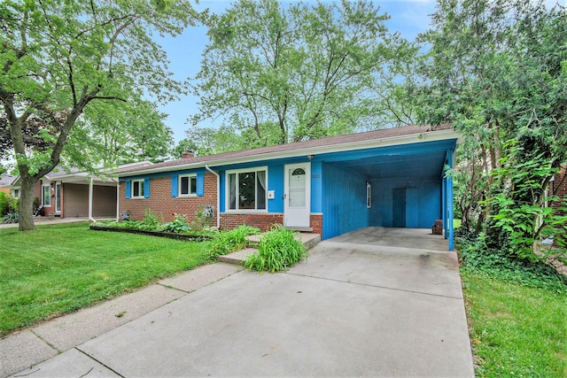 1621 Whittier Rd, Ypsilanti, MI 48197 - single story home featuring brick siding, a front yard, driveway, a chimney, and an attached carport