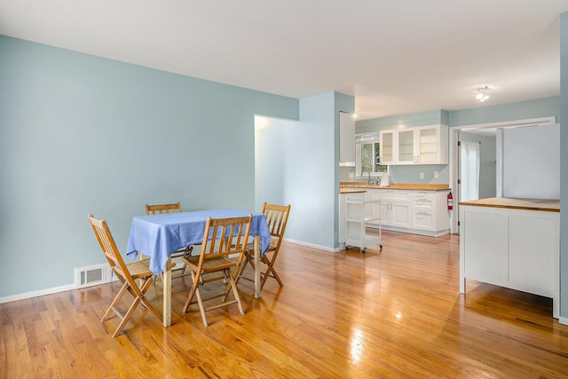 1621 Whittier Rd, Ypsilanti, MI 48197 - dining area with light wood finished floors and baseboards