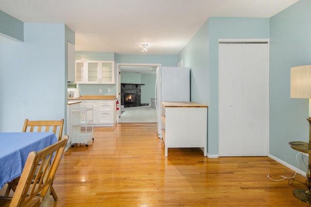 1621 Whittier Rd, Ypsilanti, MI 48197 - dining room with light wood-style floors and a fireplace