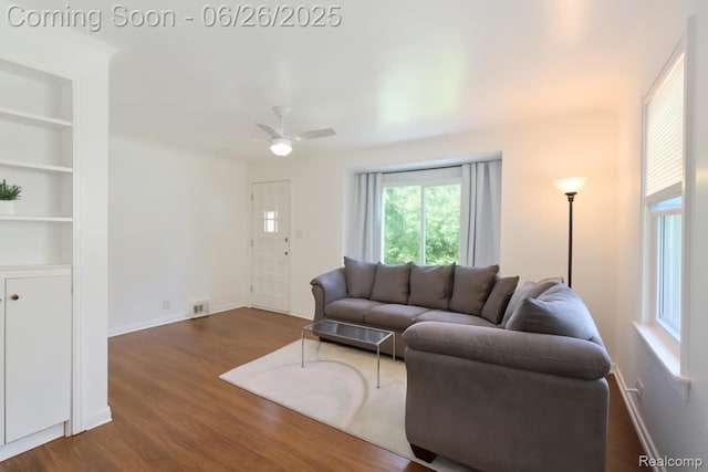 607 Chalmers St, Flint, MI 48503 - living area with wood finished floors, ceiling fan, and built in shelves