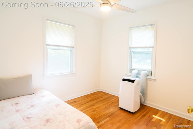 607 Chalmers St, Flint, MI 48503 - bedroom with light wood-type flooring and baseboards