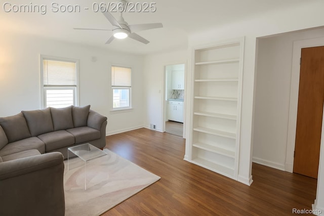 607 Chalmers St, Flint, MI 48503 - living area featuring wood finished floors, a ceiling fan, and built in features