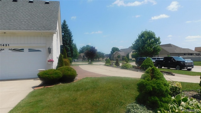 41431 Tarragon Dr, Sterling Heights, MI 48314 - view of concrete road featuring a residential view