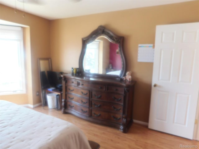41431 Tarragon Dr, Sterling Heights, MI 48314 - bedroom featuring light wood finished floors and baseboards