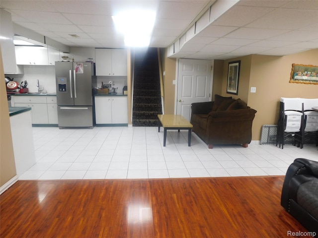 41431 Tarragon Dr, Sterling Heights, MI 48314 - living area with a drop ceiling, light tile patterned flooring, and stairway