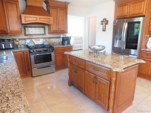 41431 Tarragon Dr, Sterling Heights, MI 48314 - kitchen with custom range hood, stainless steel appliances, decorative backsplash, and brown cabinetry