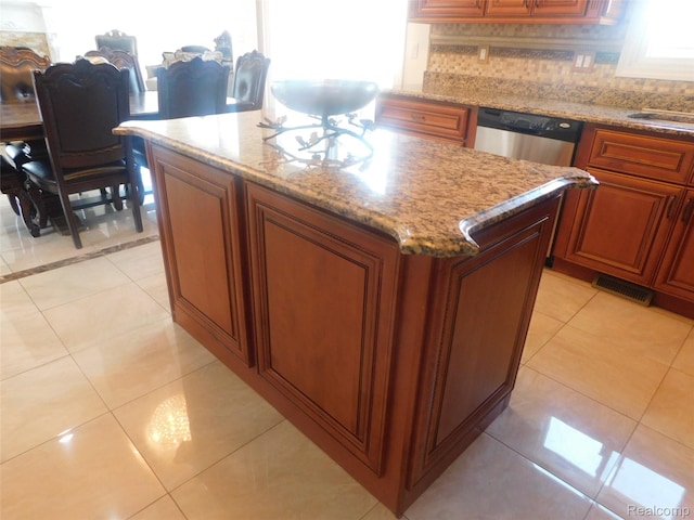 41431 Tarragon Dr, Sterling Heights, MI 48314 - kitchen featuring a center island, light tile patterned flooring, and light stone counters
