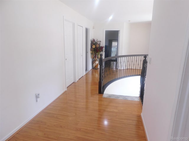 41431 Tarragon Dr, Sterling Heights, MI 48314 - hall with an upstairs landing and light wood-type flooring