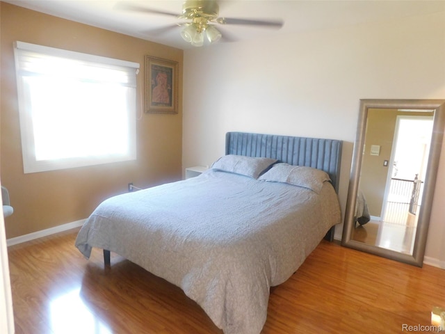 41431 Tarragon Dr, Sterling Heights, MI 48314 - bedroom featuring light wood-style flooring, multiple windows, and ceiling fan