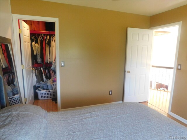 41431 Tarragon Dr, Sterling Heights, MI 48314 - unfurnished bedroom with a closet and a walk in closet