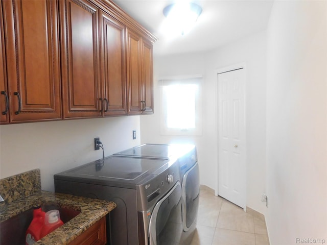 41431 Tarragon Dr, Sterling Heights, MI 48314 - laundry room with cabinet space, washer and dryer, and light tile patterned floors