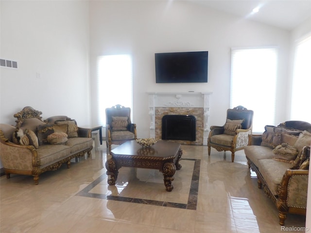 41431 Tarragon Dr, Sterling Heights, MI 48314 - living room featuring a premium fireplace and vaulted ceiling