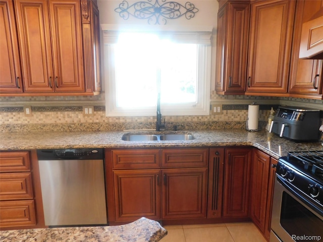 41431 Tarragon Dr, Sterling Heights, MI 48314 - kitchen featuring stainless steel appliances, brown cabinetry, and light stone countertops
