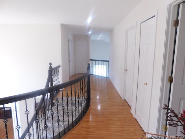 41431 Tarragon Dr, Sterling Heights, MI 48314 - hallway with an upstairs landing and light wood-style floors
