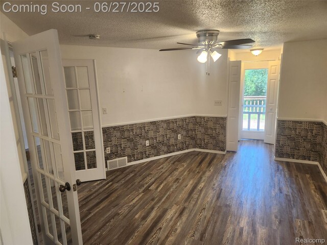 361 Irons Park Dr, West Branch, MI 48661 - empty room with wainscoting, a textured ceiling, dark wood finished floors, ceiling fan, and a smoke detector