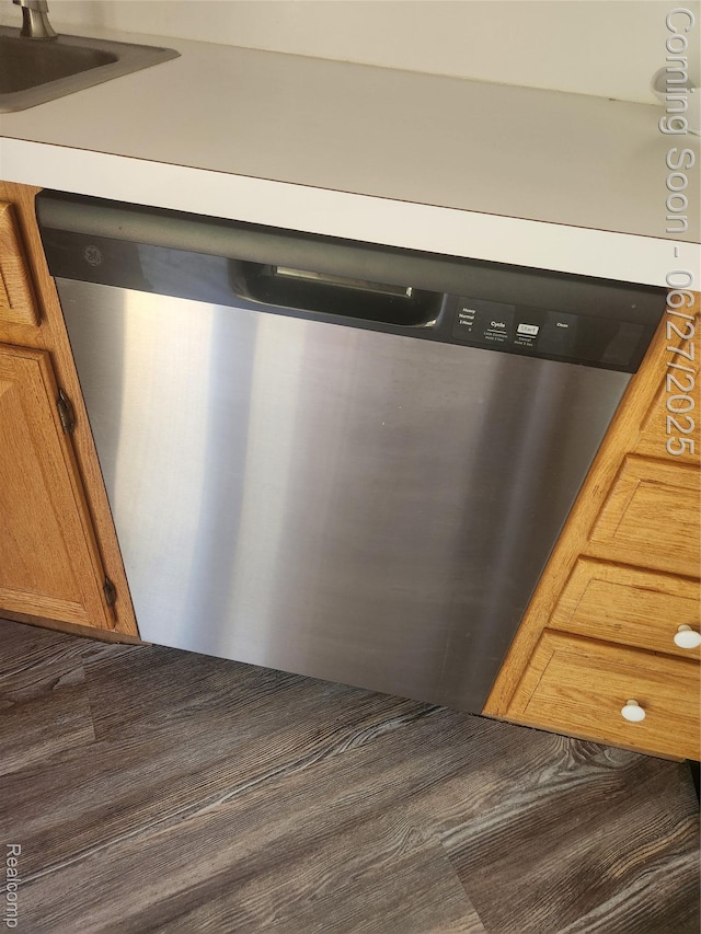 361 Irons Park Dr, West Branch, MI 48661 - detailed view of dishwasher and brown cabinets