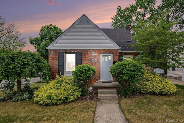 2856 Academy St, Dearborn, MI 48124 - view of front facade with brick siding and roof with shingles