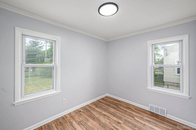 2856 Academy St, Dearborn, MI 48124 - empty room with ornamental molding and wood finished floors