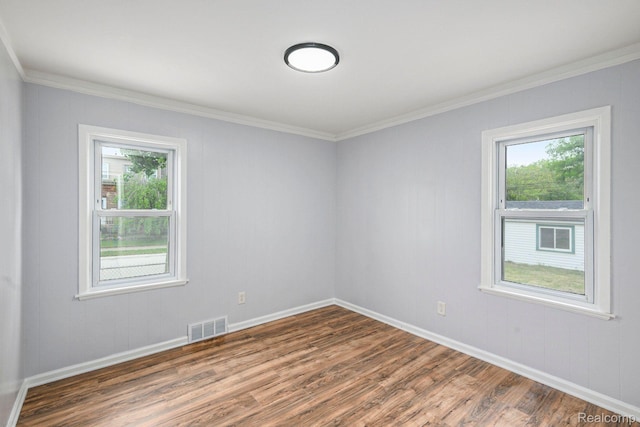 2856 Academy St, Dearborn, MI 48124 - empty room with dark wood-style floors, healthy amount of natural light, and crown molding