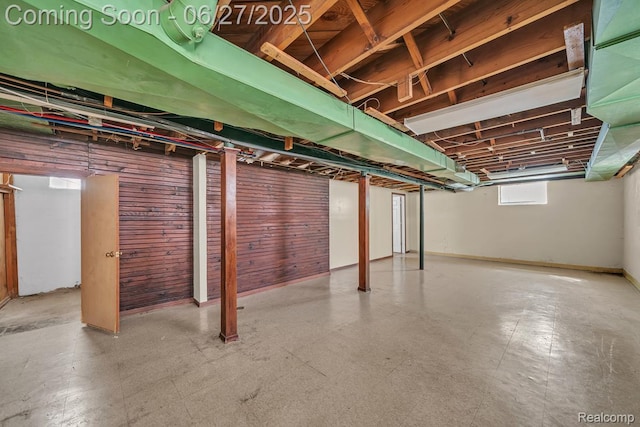 2675 Fleet St, Detroit, MI 48238 - basement featuring tile patterned floors and wood walls