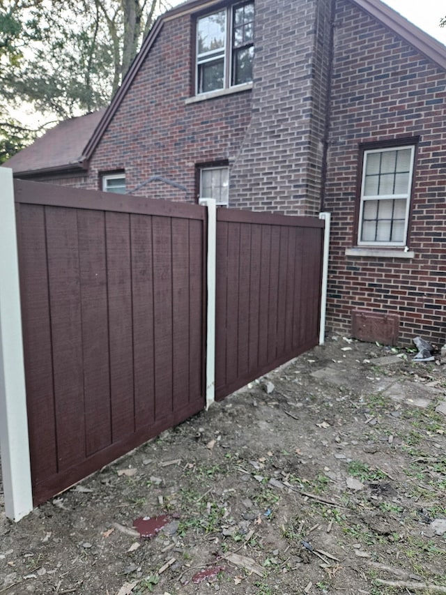 6303 Guilford St, Detroit, MI 48224 - view of side of home featuring brick siding