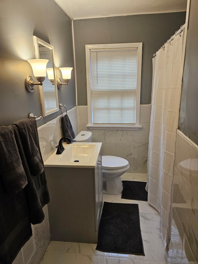 6303 Guilford St, Detroit, MI 48224 - bathroom with marble finish flooring, vanity, tile walls, a wainscoted wall, and curtained shower