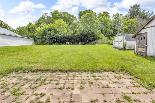 123 Fairview St, Hanover, MI 49241 - view of green lawn featuring a shed
