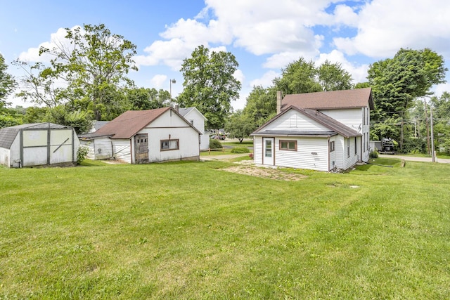 123 Fairview St, Hanover, MI 49241 - view of green lawn with a storage unit