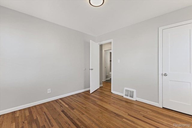 21525 Syracuse Ave, Warren, MI 48091 - unfurnished bedroom featuring wood finished floors