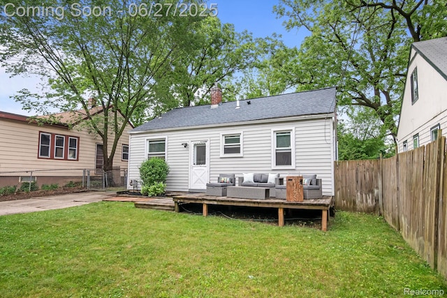 94 S Tilden Ave, Waterford, MI 48328 - back of property with a fenced backyard, a wooden deck, a chimney, a shingled roof, and outdoor lounge area