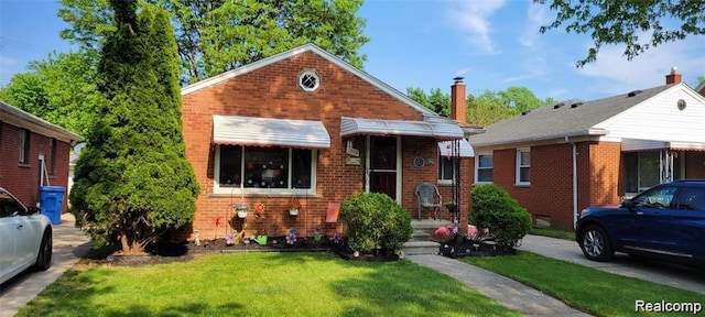 8468 Appleton St, Dearborn Heights, MI 48127 - bungalow-style house featuring brick siding and a front yard