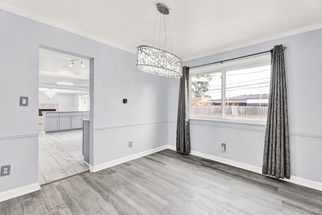 14717 Dane Ct, Sterling Heights, MI 48312 - unfurnished dining area featuring a chandelier, crown molding, and marble look tiles