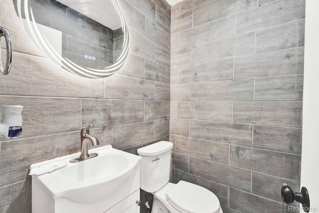 14717 Dane Ct, Sterling Heights, MI 48312 - bathroom featuring vanity and tile walls