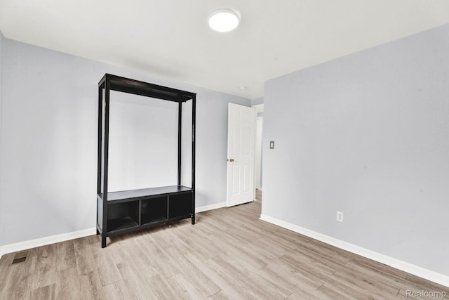 14717 Dane Ct, Sterling Heights, MI 48312 - unfurnished bedroom featuring wood finished floors and baseboards