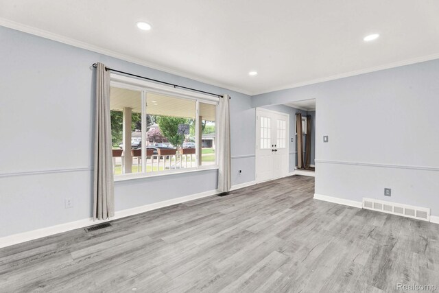 14717 Dane Ct, Sterling Heights, MI 48312 - spare room with ornamental molding, wood finished floors, and recessed lighting